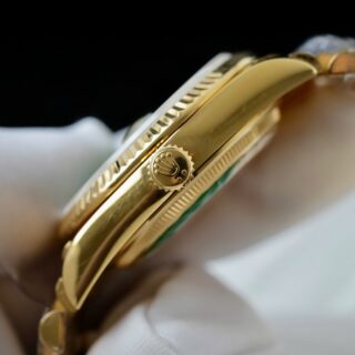 Day-Date Fluted Bezel Green Dial Presidential Bracelet on white glove