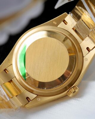 Day-Date Fluted Bezel Green Dial Presidential Bracelet on white glove