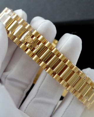 Day-Date Fluted Bezel Green Dial Presidential Bracelet on white glove