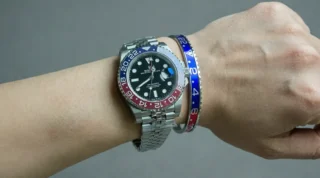 Close-up of Pepsi GMT Steel Bracelet watch with classic red and blue bezel on a man's wrist, premium titanium steel bracelet