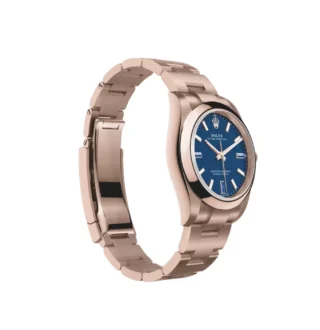 Oyster Perpetual Solid Gold 34mm Everose Gold (2026) — 18k Everose gold, blue dial with natural stone markers — angled view highlighting bezel and dial