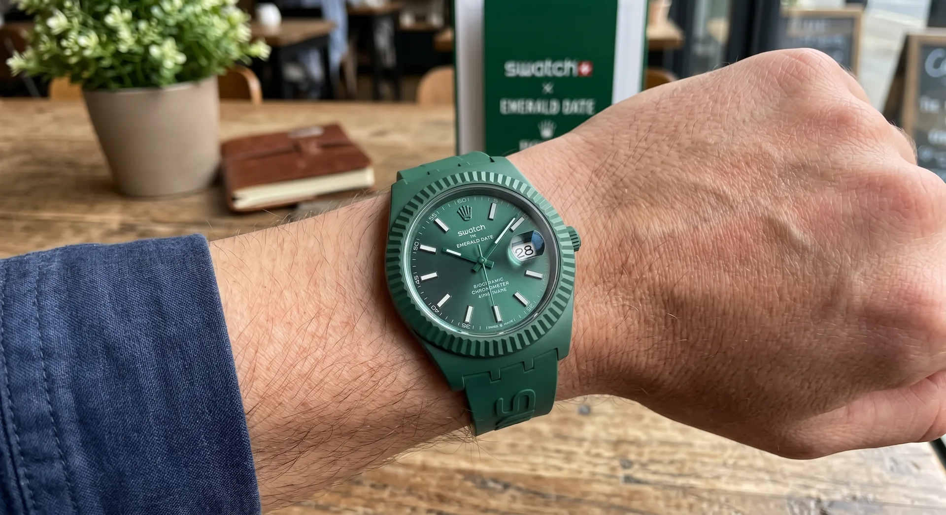 Emerald Date concept watch - green dial Day-Date style in bioceramic with rubber strap, imagined Swatch x Rolex collaboration render