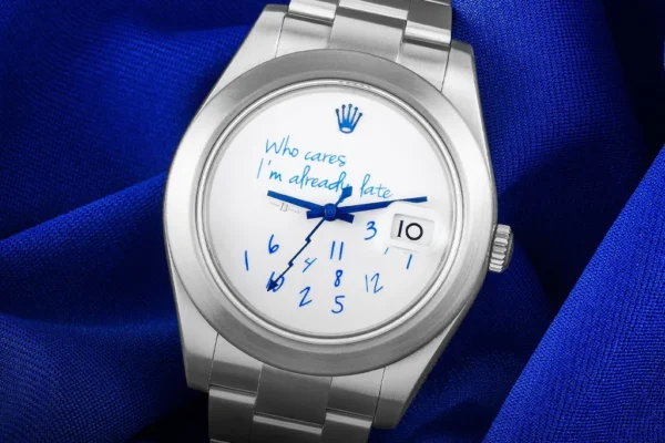 Colette x MAD Paris Who Cares I'm Already Late custom Rolex Milgauss with jumbled numerals and blue script dial